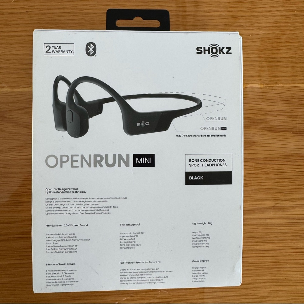 Open run mini bone conducting headphones. Used. Includes box and charging cable.